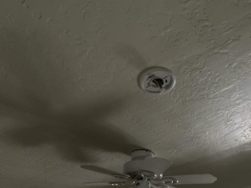 Completed membership electrical visit at 1995 residential property to address reported outlet issues. Performed comprehensive Green Shield electrical inspection, evaluating multiple outlets and circuits throughout the home. Documented ceiling-mounted electrical fixtures including HVAC register vents, smoke detectors, and ceiling fan installations to ensure proper functionality and code compliance.