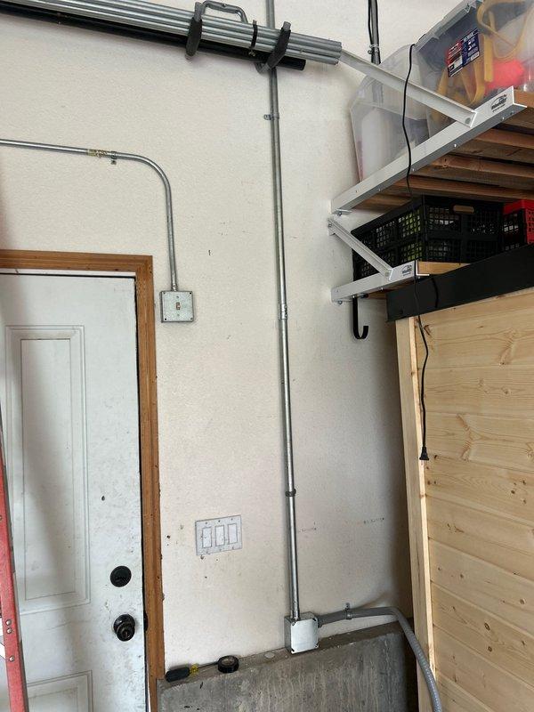Installed a dedicated 220v circuit for a Harvia sauna heater located in the garage. Utilized an available 50-amp breaker space in the existing meter panel on the front of the garage, eliminating the need for interior drywall penetration. Ran gray metal conduit from the panel along the garage wall to the sauna unit and completed all terminations at the heater, ensuring proper power supply for safe sauna operation.