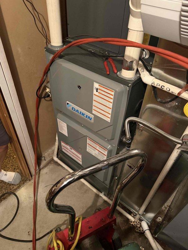 Responded to emergency mainline sewer backup affecting multiple basement fixtures including toilets and showers with active flooding impacting finished basement areas and household furnishings. Upon arrival, assessed extent of backup originating from city sewer connection causing widespread drainage failure throughout lower level plumbing system. Deployed professional drain cleaning equipment to clear mainline obstruction and restore proper flow to all affected fixtures. Verified complete drainage restoration across all basement plumbing connections and confirmed no residual blockages in the system. Documented copper plumbing components and HVAC equipment location in utility area for reference during service completion.