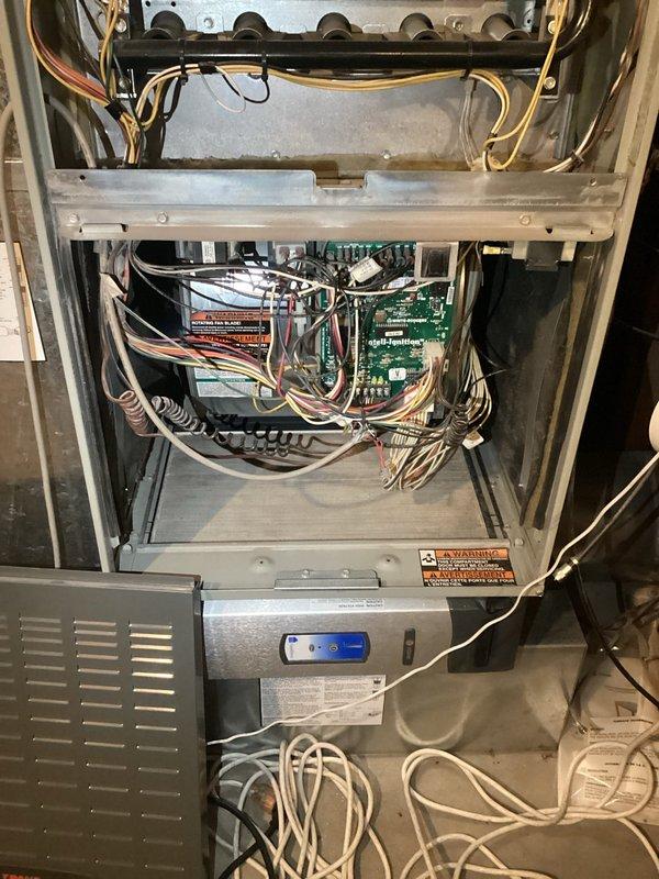 Responded to cooling complaint on residential HVAC system over 10 years old. Diagnosed evaporator coil restriction causing inadequate cooling performance, with suction pressure reading 30 PSI, head pressure at 200 PSI, and VSAT at 9 degrees. Observed evaporator coil freezing within 10 minutes of operation. Additionally identified cracked heat exchanger in furnace unit. Documented findings with photographs of furnace interior components and attic ductwork system. Presented repair and replacement options to homeowner for both cooling and heating system deficiencies.