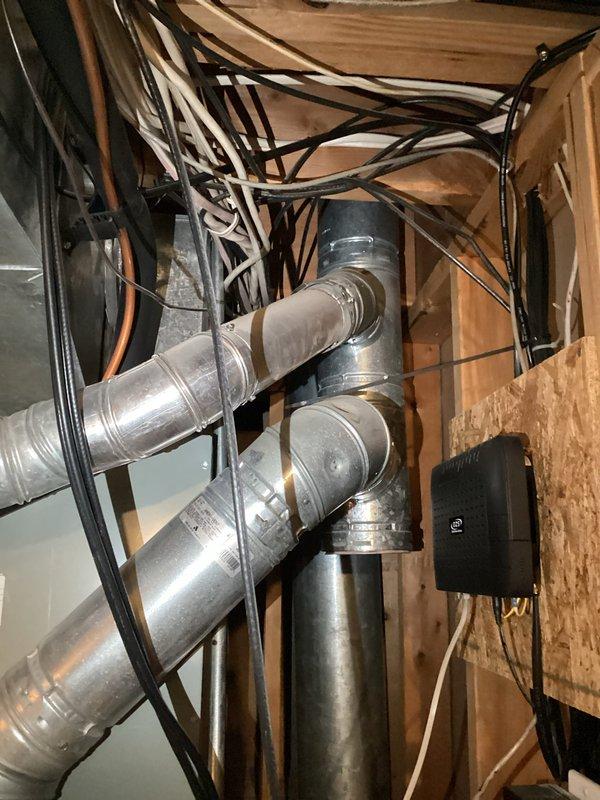 Responded to cooling complaint on residential HVAC system over 10 years old. Diagnosed evaporator coil restriction causing inadequate cooling performance, with suction pressure reading 30 PSI, head pressure at 200 PSI, and VSAT at 9 degrees. Observed evaporator coil freezing within 10 minutes of operation. Additionally identified cracked heat exchanger in furnace unit. Documented findings with photographs of furnace interior components and attic ductwork system. Presented repair and replacement options to homeowner for both cooling and heating system deficiencies.