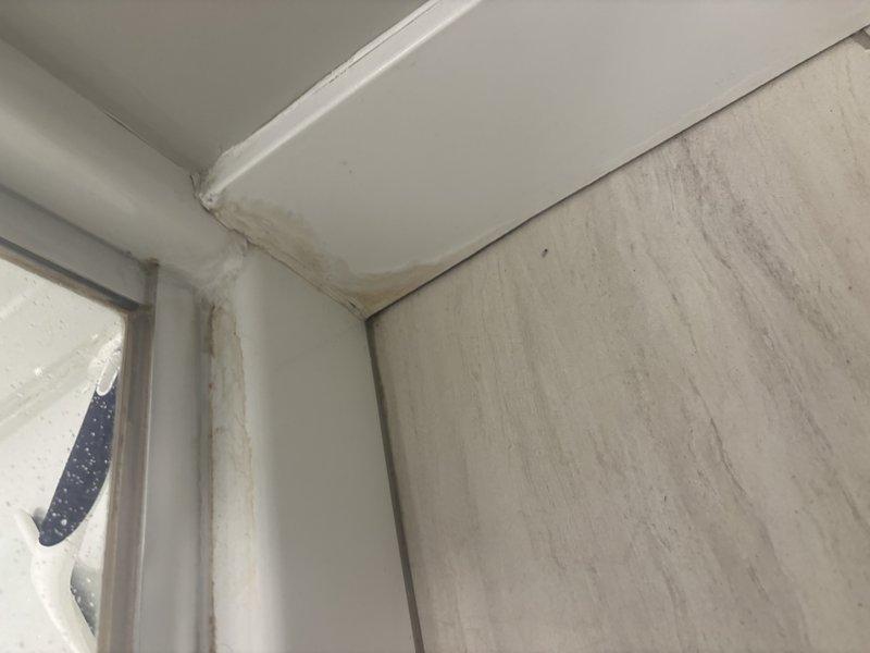 Responded to active water leak originating from upstairs master bathroom shower penetrating through to kitchen below. Upon arrival, confirmed extensive water saturation of kitchen floor and visible deterioration of ceiling sheetrock due to ongoing moisture intrusion. Traced leak source to shower pan failure in master bathroom directly above affected kitchen area. Documented water damage including compromised drywall and structural concerns from prolonged exposure. Provided evaluation of leak source and recommended necessary repairs to shower waterproofing system and replacement of damaged ceiling materials to prevent further deterioration.