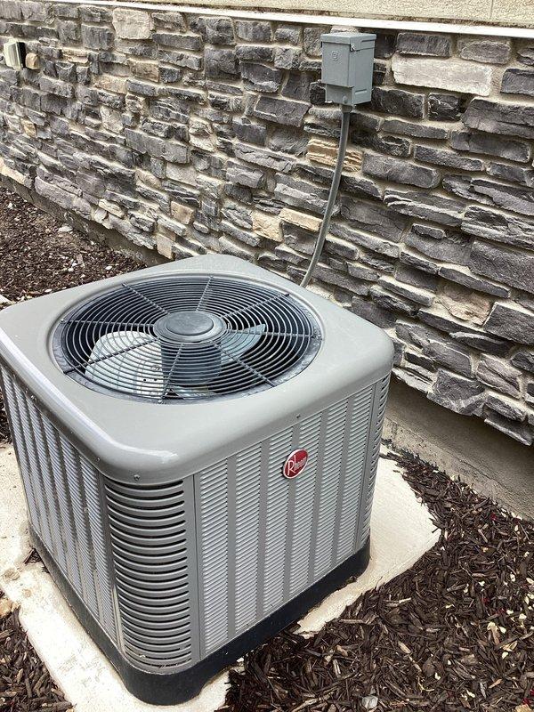 Responded to no-cooling complaint on 8-year-old residential air conditioning system. Upon arrival, confirmed condenser fan motor was not operating while blower was running. Diagnosed failed dual run capacitor preventing condenser fan from starting. Replaced defective capacitor with properly rated unit, restored power, and verified system operation. Condenser fan motor now running correctly, unit cooling properly, and all electrical connections secure.