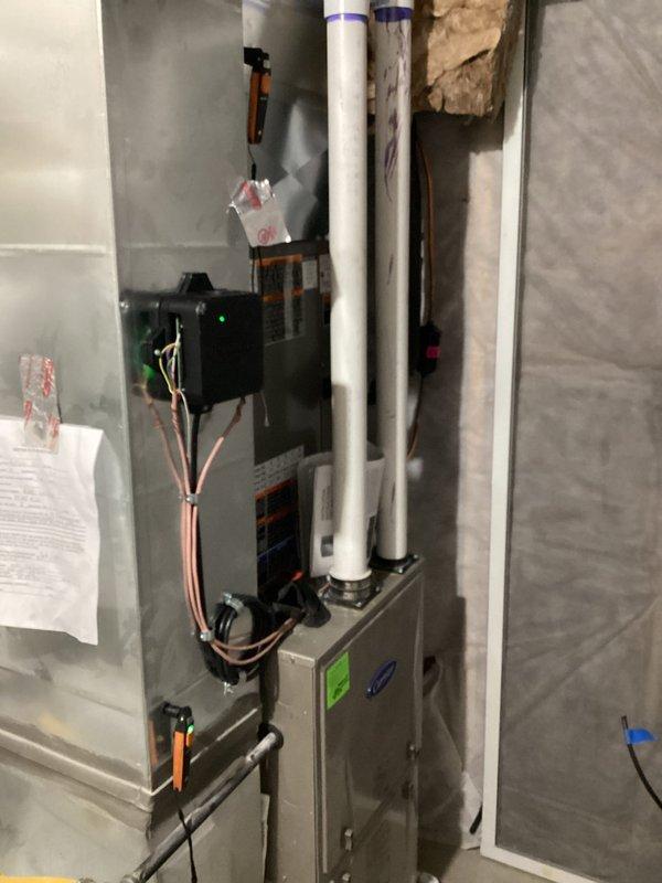 Completed installation of Lennox ML13KC1-036 3-ton air conditioning system with CK40CT-36B-71 evaporator coil. Installed new EL3030-3 outdoor pad and positioned condensing unit. Mounted air handler with evaporator coil in mechanical closet with proper electrical connections via RDS Communicating Board 27A03. Addressed airflow deficiency by enlarging basement return air system from 6-inch to 12-inch hard pipe ductwork and installed full-size return grille, repositioning connection point from top to bottom of return drop for improved airflow performance. Flushed and reused existing refrigerant lineset, evacuated system to 500 microns as verified by digital manifold, and charged system to manufacturer specifications. Retained existing thermostat per specifications. Installed 20x25x1 filters and provided three additional filters. System tested and operational with proper temperature differential and airflow confirmed.