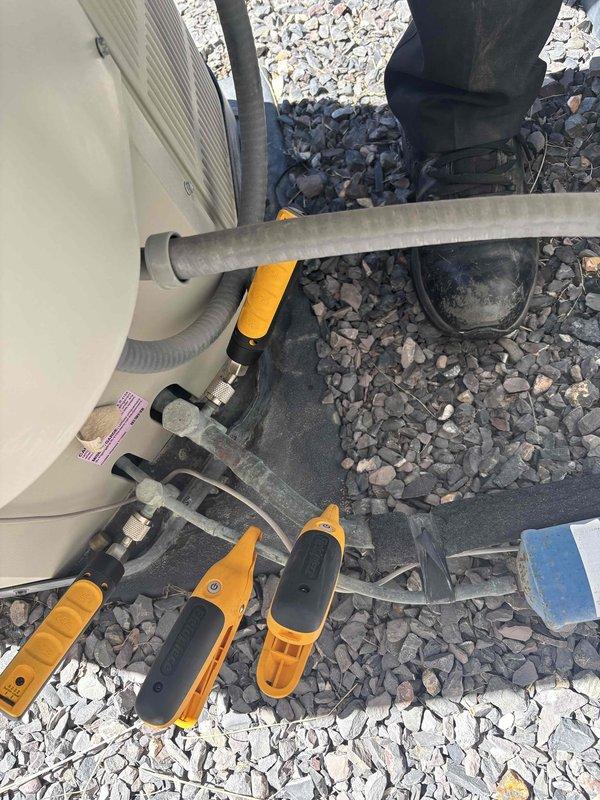 Responded to return visit for frozen evaporator coil on 2017 Frigidaire AC system. Upon arrival, system had thawed from previous freeze-up condition. Performed Cool 5-9 maintenance service including inspection of both outdoor condenser units, verified refrigerant lines and electrical connections, and assessed airflow distribution issue where unit was running but not delivering adequate air throughout the home. Documented equipment condition with photos showing dual outdoor units and associated refrigerant piping. System requires further evaluation to address underlying cause of freeze-up and resolve air distribution concerns to restore proper cooling operation.