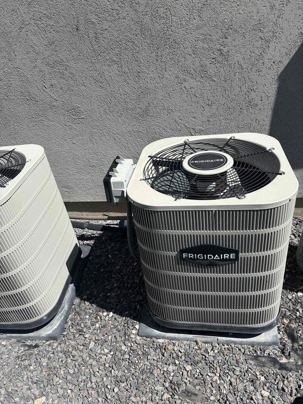 Responded to return visit for frozen evaporator coil on 2017 Frigidaire AC system. Upon arrival, system had thawed from previous freeze-up condition. Performed Cool 5-9 maintenance service including inspection of both outdoor condenser units, verified refrigerant lines and electrical connections, and assessed airflow distribution issue where unit was running but not delivering adequate air throughout the home. Documented equipment condition with photos showing dual outdoor units and associated refrigerant piping. System requires further evaluation to address underlying cause of freeze-up and resolve air distribution concerns to restore proper cooling operation.