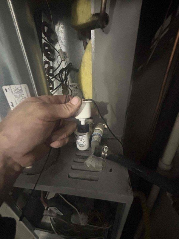 Responded to no-cooling complaint at condominium unit. Upon arrival, performed diagnostic evaluation of air conditioning system with unknown age and service history. Accessed mechanical equipment in utility closet to inspect HVAC components, ductwork connections, and associated plumbing infrastructure. Examined electrical connections, thermostat controls, and determined whether unit was individually controlled or part of building-wide system. Inspected condensate drainage lines, refrigerant lines, and gas line connections for proper installation and functionality. Evaluated system startup sequence and identified root cause of failure to operate. Documented existing mechanical configuration including copper refrigerant lines, PVC drainage, and mounting hardware in confined utility space.