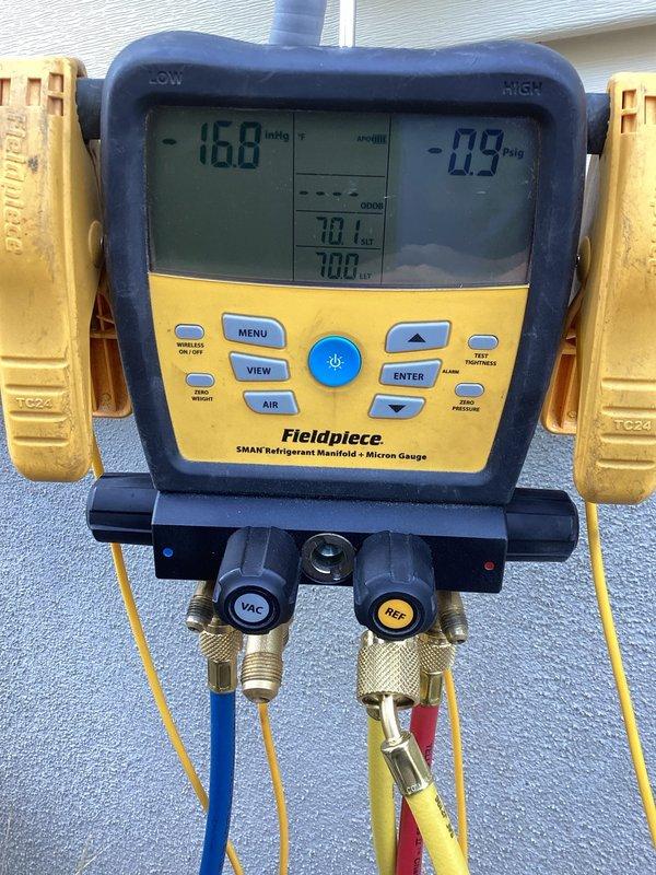 Responded to no-cooling complaint on approximately 20-year-old residential air conditioning system that had been inoperative for four days. Upon arrival, performed comprehensive system diagnostics including refrigerant pressure testing using manifold gauges, which revealed abnormal readings. Conducted vacuum test showing 168 InHg micron level to verify system integrity. Inspected indoor air handler and found severely contaminated return air grille with excessive dust, lint, and debris accumulation restricting airflow. Identified compromised system performance due to combination of refrigerant issues and inadequate air circulation from dirty filtration components. Completed Cool 10+ preventive maintenance protocol including full system evaluation, pressure diagnostics, and airflow assessment to restore cooling capacity.