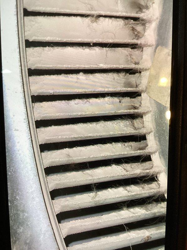 Responded to no-cooling complaint on approximately 20-year-old residential air conditioning system that had been inoperative for four days. Upon arrival, performed comprehensive system diagnostics including refrigerant pressure testing using manifold gauges, which revealed abnormal readings. Conducted vacuum test showing 168 InHg micron level to verify system integrity. Inspected indoor air handler and found severely contaminated return air grille with excessive dust, lint, and debris accumulation restricting airflow. Identified compromised system performance due to combination of refrigerant issues and inadequate air circulation from dirty filtration components. Completed Cool 10+ preventive maintenance protocol including full system evaluation, pressure diagnostics, and airflow assessment to restore cooling capacity.