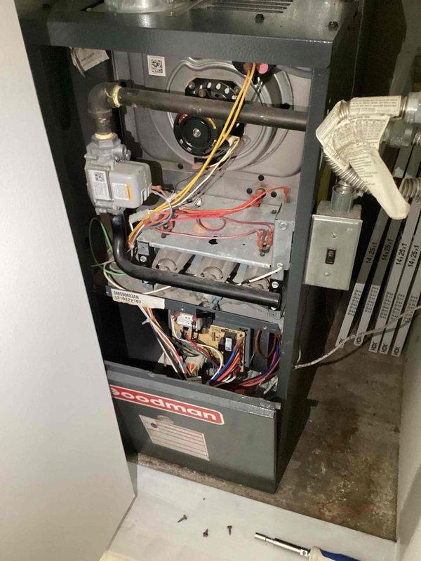 Conducted comprehensive evaluation of existing HVAC system for replacement estimate. Inspected Goodman GMS80603AN gas furnace, documenting current operational status, internal components including blower assembly, inducer motor, gas valve, burner assembly, and control board wiring. Assessed electrical connections, ductwork connections, and overall system configuration. Photographed equipment model and serial number information for replacement specifications. System currently operational; provided recommendations for complete heating and cooling system replacement options.