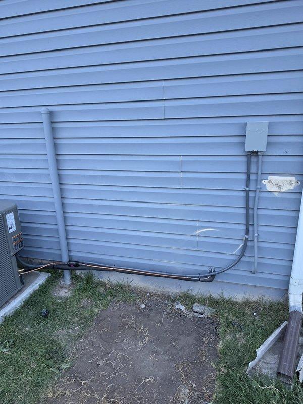 Completed full HVAC system replacement due to compromised heat exchanger in existing furnace. Installed Lennox ML196UH070XE36BK high-efficiency 96% AFUE furnace with 70,000 BTU capacity, Lennox ML13KC1-030 air conditioning condenser unit rated at 2.5 tons, and CK40HT-30B-71 evaporator coil. Replaced pressure switch with model 11U70 for proper furnace operation. Flushed and reused existing refrigerant lineset to maintain system integrity. Installed new concrete AC pad and mounted condenser unit on exterior wall with proper clearances. Installed T6 programmable thermostat for system control. Added condensate pump for proper drainage, along with PVC condensate drain lines routed to exterior. Installed 16x25x1 filter rack and provided four replacement filters. Completed all necessary sheet metal ductwork modifications to accommodate new equipment. Protected work areas with drop cloths throughout installation. Tested system operation including airflow, refrigerant charge, thermostat functio
