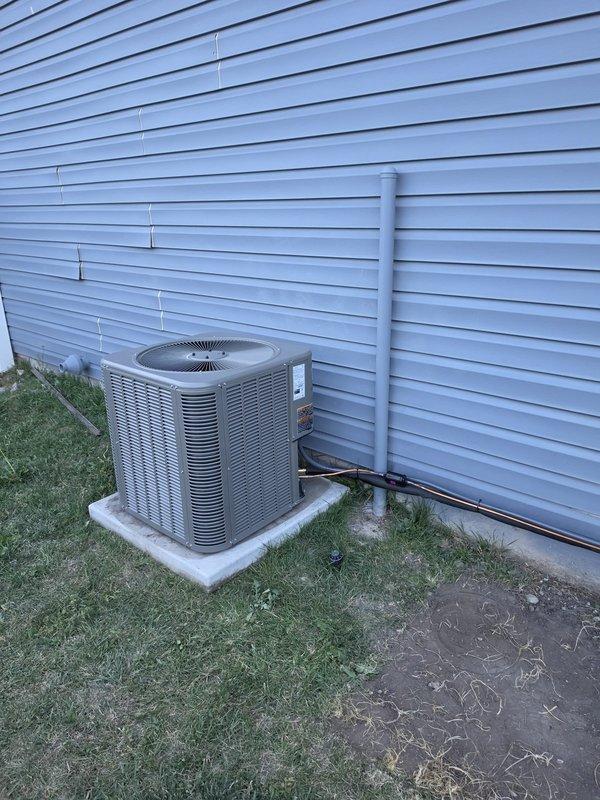 Completed full HVAC system replacement due to compromised heat exchanger in existing furnace. Installed Lennox ML196UH070XE36BK high-efficiency 96% AFUE furnace with 70,000 BTU capacity, Lennox ML13KC1-030 air conditioning condenser unit rated at 2.5 tons, and CK40HT-30B-71 evaporator coil. Replaced pressure switch with model 11U70 for proper furnace operation. Flushed and reused existing refrigerant lineset to maintain system integrity. Installed new concrete AC pad and mounted condenser unit on exterior wall with proper clearances. Installed T6 programmable thermostat for system control. Added condensate pump for proper drainage, along with PVC condensate drain lines routed to exterior. Installed 16x25x1 filter rack and provided four replacement filters. Completed all necessary sheet metal ductwork modifications to accommodate new equipment. Protected work areas with drop cloths throughout installation. Tested system operation including airflow, refrigerant charge, thermostat functio