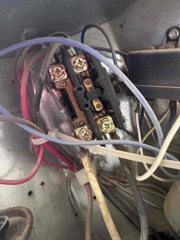 Completed comprehensive AC tune-up as part of annual maintenance membership. Performed full system inspection including electrical connections at terminal block, which showed normal wear and accumulated dust. Verified all wire connections were secure at the brass terminal strip. Utilized SC440 digital meter to test system parameters and confirm proper operation. All components functioning within manufacturer specifications at time of service.
