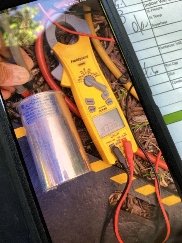 Completed routine Green Shield cooling maintenance on 10-year-old HVAC system with units in garage and backyard. Performed comprehensive system diagnostics using digital manifold gauge to verify refrigerant pressures, temperatures, and superheat levels, with all readings within normal operating parameters. Tested run capacitor with clamp meter, confirming proper microfarad rating and amperage draw. No issues reported by member and no deficiencies found during inspection.