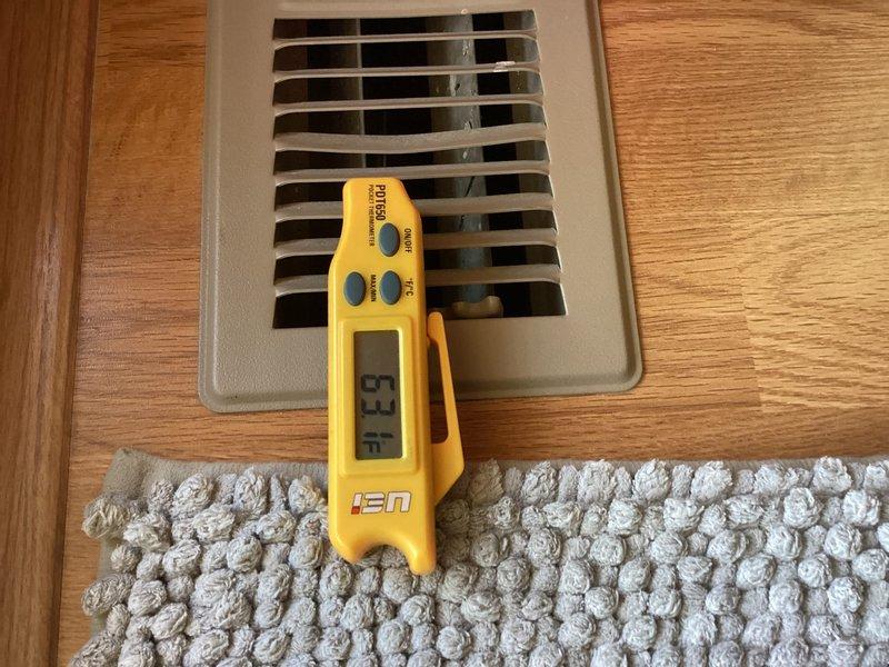 Responded to no-cooling complaint on 10+ year old air conditioning system with ground-level condenser and basement furnace. Performed diagnostic evaluation of system including temperature measurements at supply registers and inspection of refrigerant lines and connections at outdoor unit. Confirmed tenant report that system was blowing air but not producing cool air, requiring further assessment of compressor operation, refrigerant charge levels, and potential component failures to determine necessary repairs.