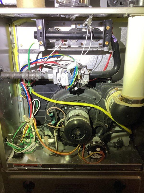 Performed safety and operations tune-up on 3-year-old HVAC system to investigate recurring musty odor occurring when air conditioning operates during summer months. Conducted 21-point inspection of furnace and AC components, including thorough examination of evaporator coil using inspection camera to check for biological growth, debris accumulation, and condensation issues that could produce odors. Inspected blower motor assembly, gas valve, electrical connections, and condensate drainage system for proper operation and potential sources of smell. Documented internal cabinet condition and evaporator coil fins with photographic evidence. System operational at time of service with no immediate safety concerns identified.