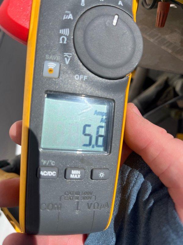 Completed routine maintenance tune-up on an 8-9 year old HVAC unit located on the roof, approximately 10 feet off the ground. Performed standard diagnostic testing using digital multimeter, recording temperature readings of 52.8°F and amperage draw of 5.2 amps during system operation. No issues were reported by customer prior to service, and system showed normal operating parameters throughout inspection. All maintenance procedures completed as scheduled, with photographic documentation taken for service records.