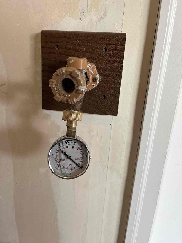 Responded to report of toilet making noises during flushing in hallway bathroom. Removed tank lid and inspected internal flush mechanism components including flush valve, fill valve, and float assembly. Verified water pressure at residential plumbing system using pressure gauge. Identified worn or malfunctioning flush valve assembly causing noise issue during flush cycle. Replaced defective flush valve components and adjusted float mechanism to proper water level. Tested toilet operation through multiple flush cycles to confirm noise elimination and proper refill function.
