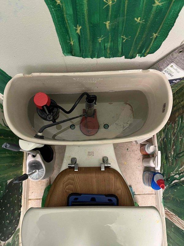 Responded to report of toilet making noises during flushing in hallway bathroom. Removed tank lid and inspected internal flush mechanism components including flush valve, fill valve, and float assembly. Verified water pressure at residential plumbing system using pressure gauge. Identified worn or malfunctioning flush valve assembly causing noise issue during flush cycle. Replaced defective flush valve components and adjusted float mechanism to proper water level. Tested toilet operation through multiple flush cycles to confirm noise elimination and proper refill function.
