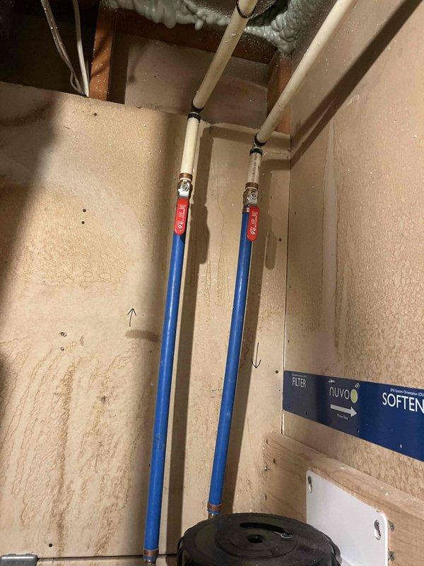Completed membership plumbing inspection at residential property with focus on tankless water heater system located in lower level. Inspected whole-house water filtration system including Craig's Aqua filter canister, blue PEX supply lines, and associated plumbing connections. Evaluated filter condition per homeowner request regarding potential replacement needs. Documented existing water staining on wall below filtration system and verified proper operation of water softener/filtration equipment. All plumbing connections, mounting hardware, and system components inspected for proper function and potential maintenance requirements.