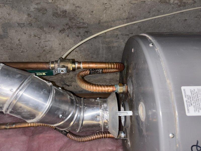 Installed thermal expansion tank on existing water heater system in basement to satisfy home inspection requirements for property sale. Assessed existing water heater condition and discussed code compliance requirements regarding thermal pressure relief. Verified water pressure within acceptable parameters prior to installation. Connected expansion tank to cold water supply line using appropriate fittings and secured unit according to manufacturer specifications. Installation completed with minimal modification to existing plumbing system per homeowner request.