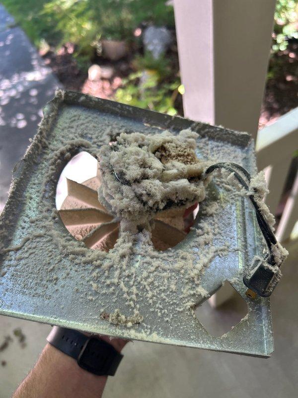 Serviced ceiling-mounted exhaust fan that had experienced reduced airflow and operational issues due to severe lint and debris accumulation. Removed ventilation cover, cleaned extensive buildup from fan blades, motor housing, and louver assembly, then verified proper operation and airflow upon reassembly.