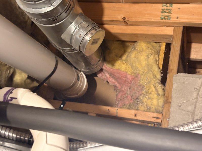 Performed comprehensive inspection and maintenance on tankless water heater unit located in attic space. Examined venting system, electrical connections, and water supply lines for proper operation and code compliance. Assessed PVC piping network and verified proper installation of exhaust and intake vent terminations, confirming all mechanical systems functioning within manufacturer specifications.