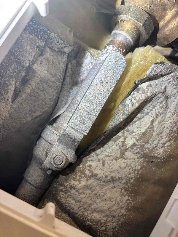 Completed annual plumbing maintenance inspection as part of Green Shield membership benefits. Performed comprehensive visual inspection of all accessible plumbing systems, fixtures, and water heating equipment. Inspected water heater installation, verified proper venting through flexible duct, checked condition of copper and PEX supply lines, and confirmed all connections were secure without visible leaks. Noted significant frost and ice accumulation on HVAC refrigeration lines in mechanical area, indicating possible refrigerant leak or system malfunction requiring separate HVAC service attention. All plumbing components functioning properly with no immediate repairs needed at time of inspection.