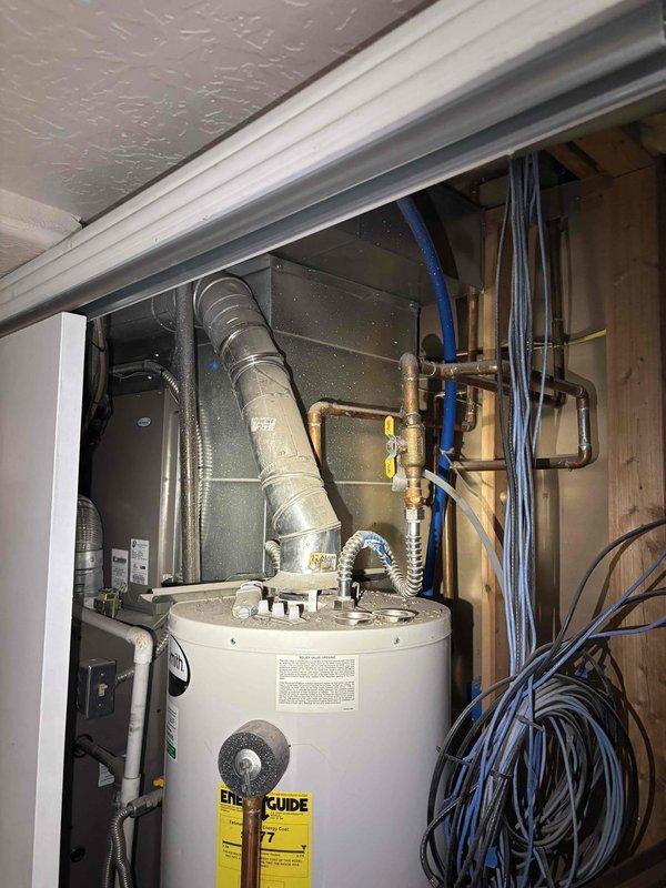Completed annual plumbing maintenance inspection as part of Green Shield membership benefits. Performed comprehensive visual inspection of all accessible plumbing systems, fixtures, and water heating equipment. Inspected water heater installation, verified proper venting through flexible duct, checked condition of copper and PEX supply lines, and confirmed all connections were secure without visible leaks. Noted significant frost and ice accumulation on HVAC refrigeration lines in mechanical area, indicating possible refrigerant leak or system malfunction requiring separate HVAC service attention. All plumbing components functioning properly with no immediate repairs needed at time of inspection.