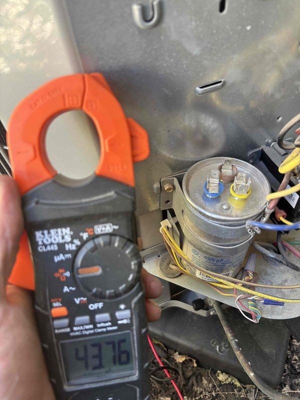 Completed preventative maintenance on 1.5-year-old residential cooling system at townhouse property. Performed comprehensive AC tune-up including electrical diagnostics with amp draw readings on capacitor (43.79A measured), inspected blower wheel assembly for cleanliness and proper operation, and verified all system components functioning within normal parameters with no issues reported.