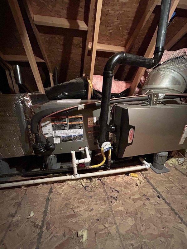 Completed full HVAC system replacement in attic space, installing Lennox EL297UH070XV36BK 90% efficiency furnace, EL18KSLV-036 air conditioner with 3-ton capacity, and CK40HT-36B-71 evaporator coil. Installed S40 programmable thermostat with outdoor sensor for optimal system control and efficiency monitoring.

Configured condensate drainage system with PVC piping routed to existing floor drain. Installed 16x25x5 filter cabinet with MERV 11 filter for improved air quality. Added pressure switch (14A48) and 6-inch pump riser components from inventory to ensure proper furnace operation and condensate removal.

Flushed and reused existing refrigerant lineset, ensuring system integrity and proper refrigerant flow. Installed new AC pad (EL2448-3) for outdoor condensing unit placement. Connected all ductwork to air handler unit with proper sealing and support. Completed all electrical connections including thermostat wiring and outdoor sensor integration.

System was pressure tested, evacuate