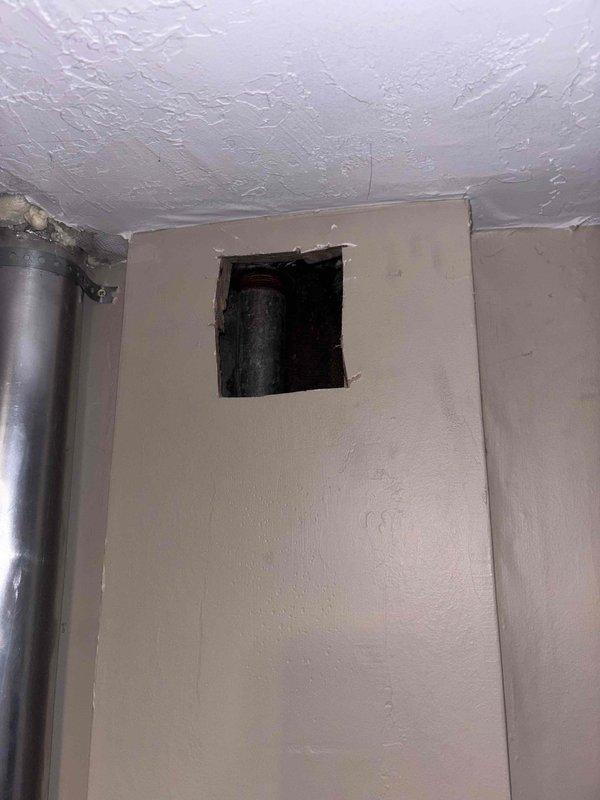 Responded to kitchen sink backup with black water on main floor. Accessed drain line through wall opening to clear blockage and restore proper drainage. No chemical drain cleaners had been used prior to service call.