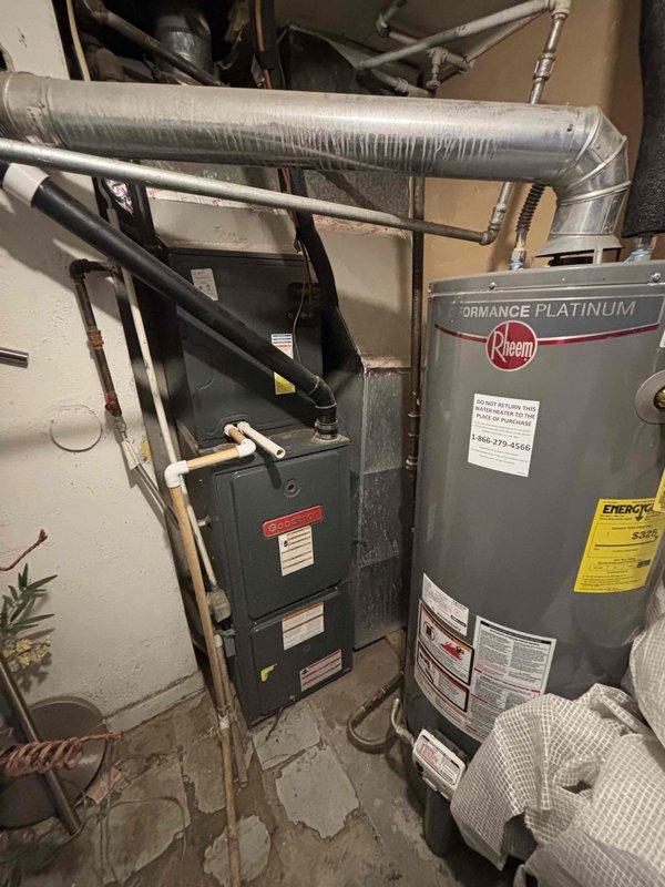 Completed scheduled cooling system maintenance on residential HVAC system. Performed comprehensive inspection of Goodman furnace and associated equipment in basement mechanical room. Checked refrigerant lines, ductwork connections, and system components for proper operation. Inspected flexible and rigid ductwork for secure installation and adequate insulation. Verified all mechanical systems operational and documented existing conditions including ceiling-mounted refrigerant lines, PVC drainage piping, and insulated supply lines showing normal condensation patterns.