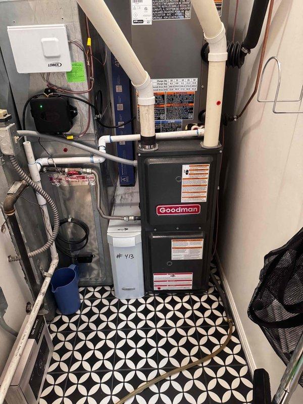 Completed preventive maintenance on two Goodman HVAC systems, both under 5 years old, located in basement mechanical room. Performed comprehensive cooling system inspection including filter check, refrigerant level verification, electrical connection inspection, condensate drain line evaluation, and thermostat calibration on both units. All systems operating within manufacturer specifications with no reported issues or deficiencies found during inspection.