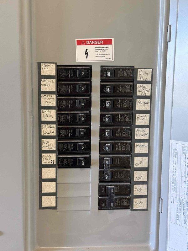 Completed on-site estimate for new central HVAC system installation at residential property. Assessed interior spaces, documented existing electrical panel with labeled circuit breakers, and evaluated rooms with baseboard heating for conversion to forced-air system. Photographed electrical infrastructure to determine capacity for new HVAC equipment and documented interior conditions including carpeted rooms, ceiling types, and window placements to calculate proper system sizing and ductwork requirements.