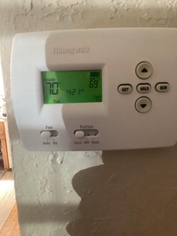 Responded to cooling complaint on 10+ year old system experiencing reduced airflow and inadequate cooling, with unit unable to maintain setpoint of 70°F and only reaching 75°F. Performed comprehensive Cool 10+ preventive maintenance inspection on single AC unit located outside with furnace in basement. Measured supply air temperature at 61.8°F and verified thermostat operation showing current reading of 73°F. Completed full system evaluation including refrigerant levels, airflow measurements, electrical connections, and condensate drainage to restore proper cooling performance.