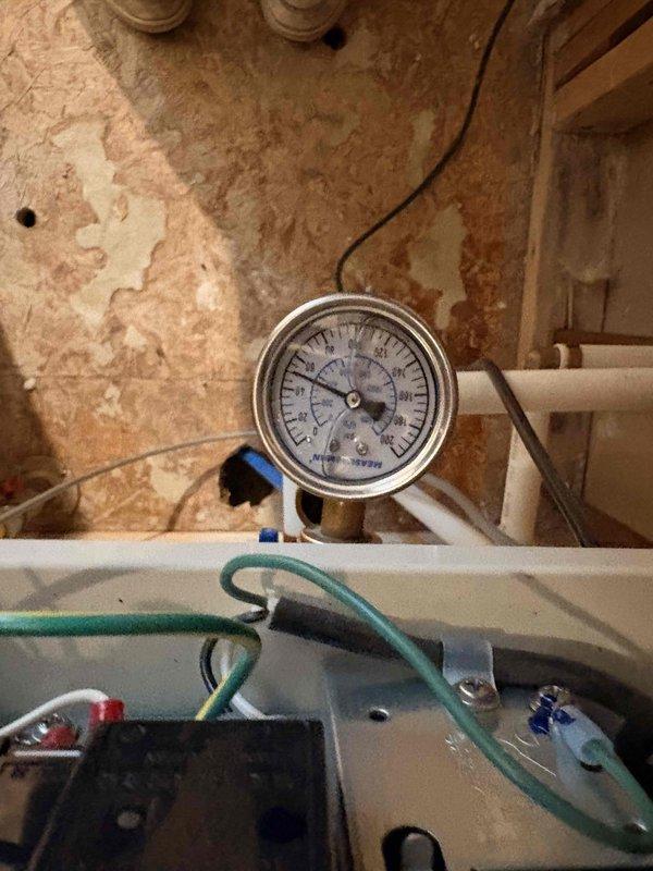 Responded to no hot water condition on 11-year-old tankless water heater displaying error code 90. Inspected unit with front panel removed, examined internal components including heat exchanger, gas valve, ignition system, and venting connections. Diagnosed combustion failure indicated by error code 90, which was not resolved by standard reset procedure. Evaluated system pressure, electrical connections, and gas supply to isolate failure point.