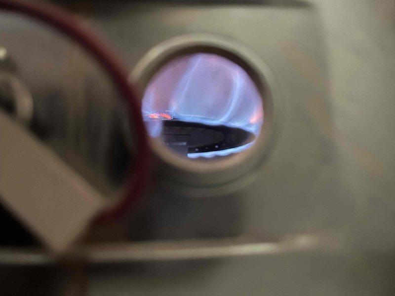 Responded to no hot water complaint on 2007 Bradford White tanked water heater with pilot light failure. Inspected unit and successfully relit pilot light using proper safety procedures. Verified burner ignition, flame characteristics showing proper blue combustion pattern, and confirmed thermocouple operation. Unit restored to full operational status with hot water production resumed.