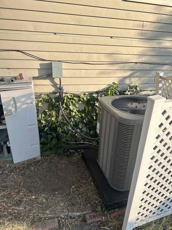 Completed full HVAC system replacement including installation of Lennox ML180UH070E36AK 80% efficiency furnace (70,000 BTU), ML13KC1-024 air conditioning condenser unit (2-ton), and CK40CT-24A-71 evaporator coil. Replaced inadequate flexible flue piping with proper double-wall venting system to meet code requirements and ensure safe furnace operation. Installed new AC pad, flushed and reused existing lineset, mounted outdoor disconnect with 20-amp fuses, installed T6 programmable thermostat, and added 16x25x1 filter rack with filters; system tested and operational.