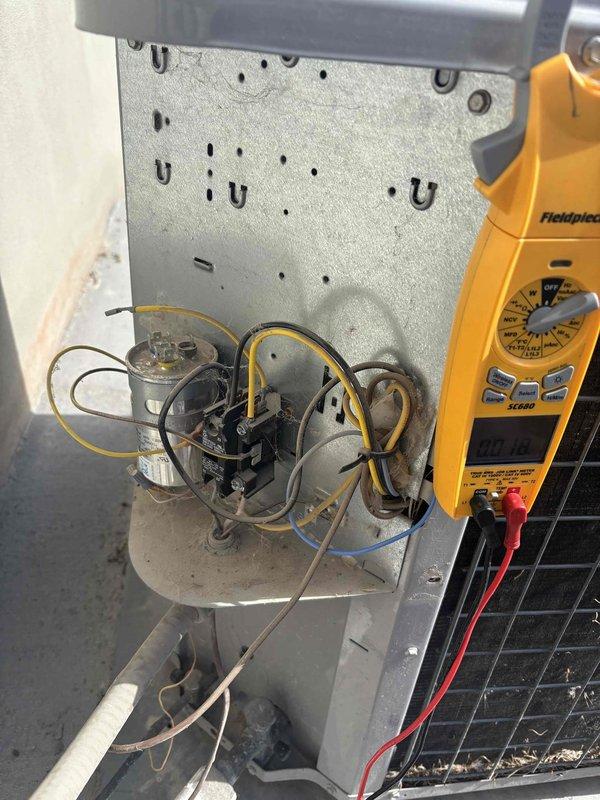 Responded to residential no-cooling complaint where air handler was operating but system failed to produce cold air. Performed comprehensive Cool 10+ diagnostic inspection of outdoor condensing unit and indoor components. Utilized digital multimeter to test capacitor, contactor, and electrical connections at control panel. Verified proper voltage supply and measured capacitance values on run capacitor. Inspected compressor contactor for signs of pitting or wear on contact points. Evaluated all wire terminations and electrical connections for integrity. Assessed refrigerant system components and operational status of compressor. Provided customer with diagnostic findings and repair recommendations to restore cooling functionality to the system.