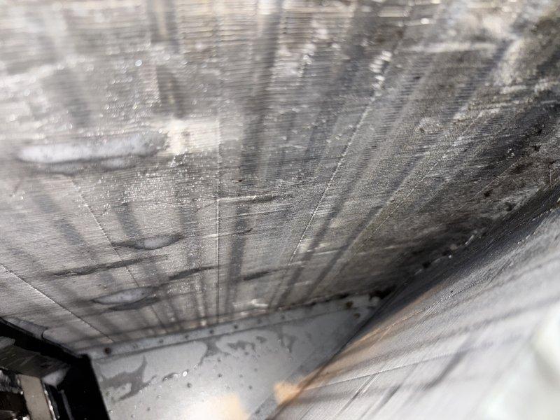 Performed comprehensive evaporator coil cleaning on residential HVAC system. Coil exhibited significant dust accumulation and oxidation residue buildup on fins, which was thoroughly removed to restore optimal heat transfer efficiency. Accessed unit through existing ductwork, cleaned metallic fins and surrounding components, and verified proper airflow upon completion.