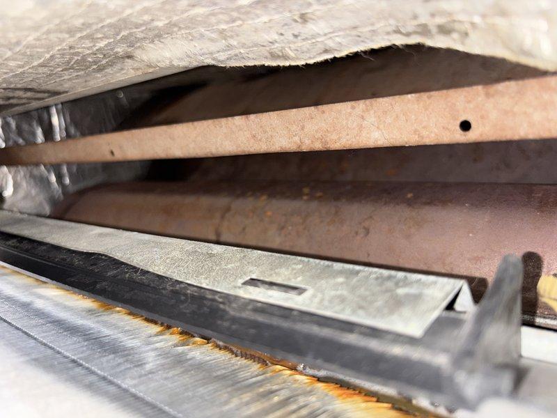 Performed comprehensive evaporator coil cleaning on residential HVAC system. Coil exhibited significant dust accumulation and oxidation residue buildup on fins, which was thoroughly removed to restore optimal heat transfer efficiency. Accessed unit through existing ductwork, cleaned metallic fins and surrounding components, and verified proper airflow upon completion.
