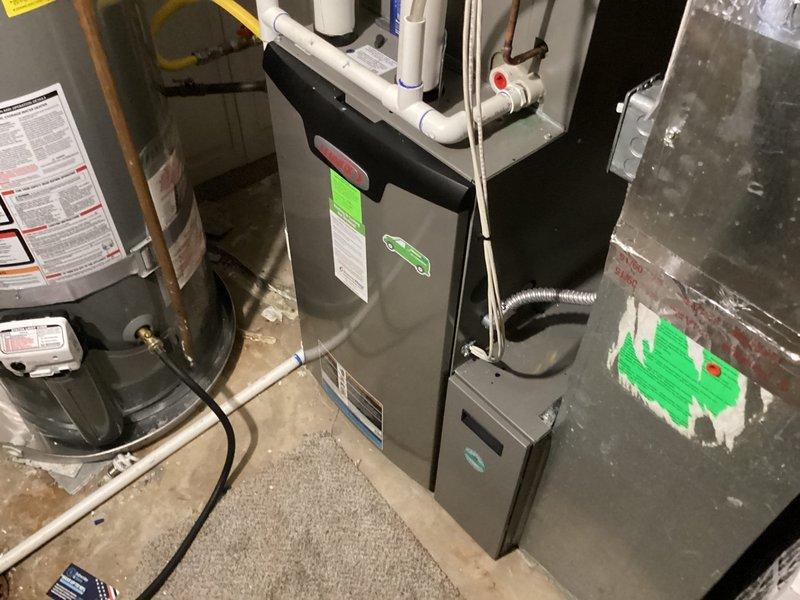 Completed routine cooling maintenance on a 4-year-old residential HVAC system. Inspected furnace and air handler in basement, verified air filter condition showing normal dust accumulation with pleated media intact, checked all mechanical components and connections including PVC condensate drainage and copper refrigerant lines. All equipment operating within normal parameters with no reported issues or deficiencies noted during inspection.