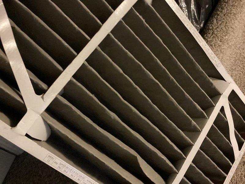 Completed routine cooling maintenance on a 4-year-old residential HVAC system. Inspected furnace and air handler in basement, verified air filter condition showing normal dust accumulation with pleated media intact, checked all mechanical components and connections including PVC condensate drainage and copper refrigerant lines. All equipment operating within normal parameters with no reported issues or deficiencies noted during inspection.