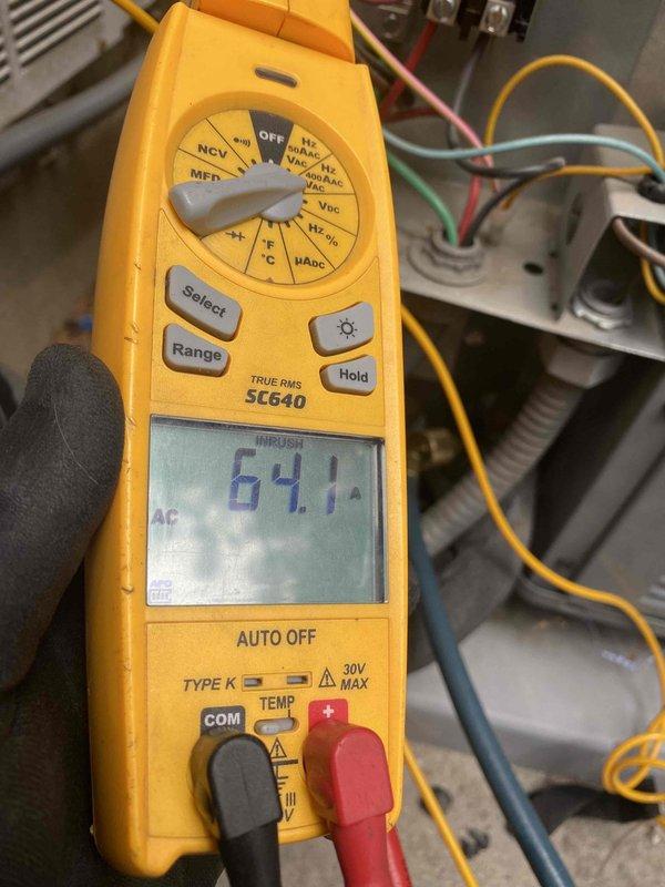 Completed preventive maintenance on 4-year-old ground-level cooling system as part of recurring membership service with no reported issues. Performed comprehensive system diagnostics using digital multimeter to verify electrical readings, including voltage measurements at 0.2V and capacitance testing at 454µF, along with amperage draw verification showing 64.1A. Inspected all electrical connections, control board wiring, and CoreSense diagnostic monitoring system to ensure proper operation and system efficiency.