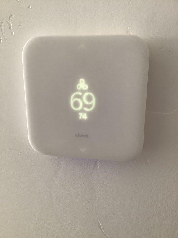 Responded to a no cooling complaint on a 6-9 year old Carrier air conditioning system. Upon arrival, found the outdoor unit running but home unable to cool below 73-75°F despite thermostat set to 69°F. Conducted comprehensive system inspection including airflow assessment, refrigerant charge verification, and component operation testing. Discovered significant deterioration and degradation on ductwork components affecting system performance. Documented thermostat displaying 74°F actual temperature with 69°F setpoint. Diagnosed root cause of reduced cooling capacity and provided recommendations for necessary repairs to restore proper system operation and achieve desired temperature setpoints.