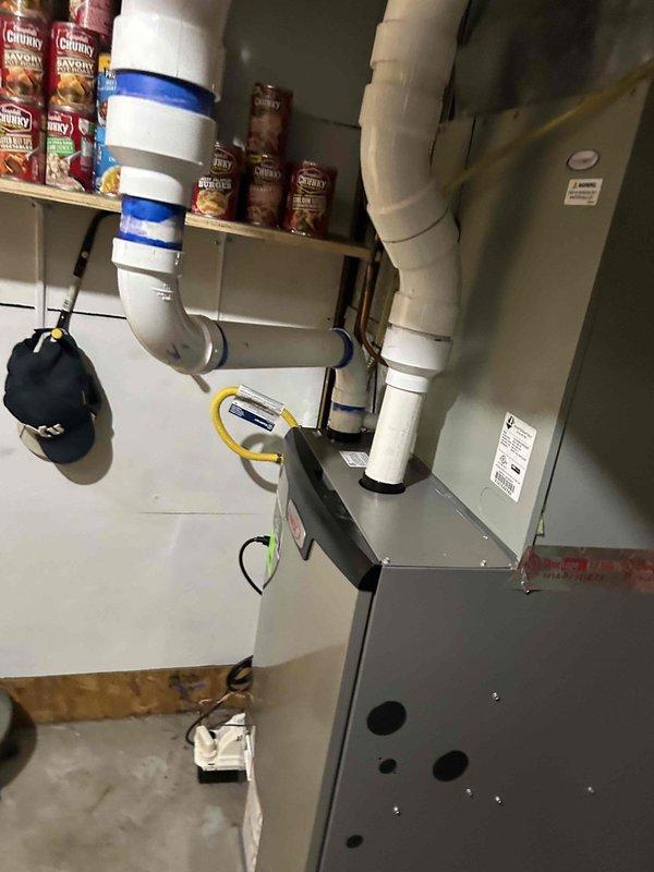 Successfully installed a Lennox EL297UH090XV48CK 90% efficiency furnace with base and pressure switch in basement utility room. Installation included PVC venting system, condensate pump for drainage management, T6 thermostat, and 20x25x1 filter rack with filters. All equipment tested and operational upon completion.