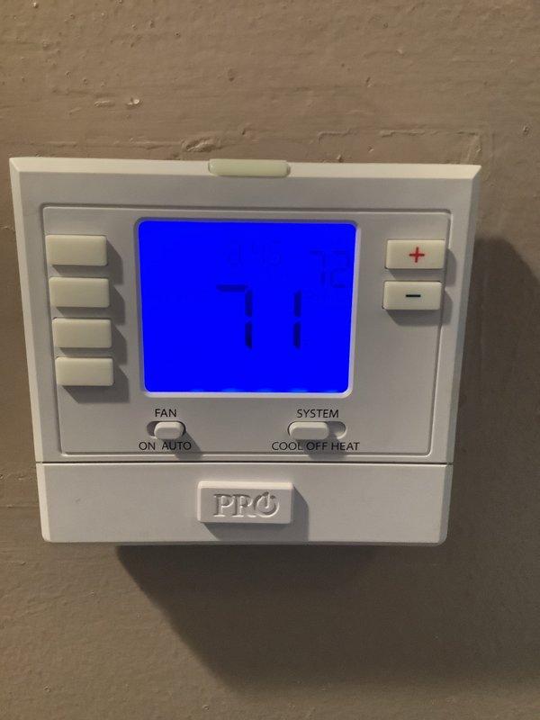 Responded to report of air conditioning unit running constantly with unusual clanking noise and water leakage. Upon inspection, found severe frost buildup extending from evaporator coil to compressor on 8-year-old single-zone system. Instructed customer to shut off cooling mode and leave fan in ON position to facilitate complete thaw of frozen components. Scheduled return visit for following afternoon to perform full diagnostic testing and complete necessary repairs once system had fully defrosted. Applied foam insulation to exposed refrigerant lines at exterior location to prevent future condensation issues.