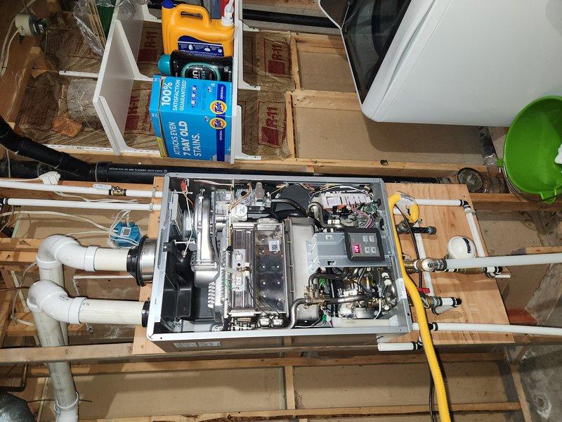 Responded to service call for 4-year-old tankless water heater in basement producing only lukewarm water instead of hot water. Inspected unit and associated plumbing components including pressure reducing valve assembly on copper supply lines. Diagnosed issue, performed necessary adjustments or repairs to restore proper hot water temperature output to whole home system.