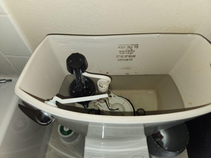 Responded to callback for loud humming noise in upstairs bathroom following recent pressure gauge replacement on 35-year-old plumbing system. Inspected pressure gauge reading approximately 150 psi and verified proper installation of brass fittings and copper piping connections. Examined toilet tank components including flapper valve, float mechanism, and flush assembly for potential vibration or noise sources. Documented system conditions with photographic evidence showing pressure gauge operation and toilet tank interior. Provided previous invoice documentation as requested and updated contact information for future service records.